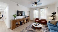 Located at 4201 William Fleming in Fort Worth, TX, this single-floor, 2-bedroom, 2-bathroom residence offers a thoughtfully designed layout with modern finishes throughout. Light wood-look flooring flows seamlessly across the living spaces, complemented by crisp white walls and ceiling fans in each room.

The open-concept living, dining, and kitchen area serves as the heart of the home. The living room features large windows that invite abundant natural light and offer outdoor views, while providing ample space for comfortable seating. The kitchen is outfitted with stainless steel appliances, dark granite countertops, a subway tile backsplash, and taupe cabinetry with black hardware — a clean, contemporary aesthetic paired with everyday functionality. A dedicated dining area sits adjacent to the kitchen.

The primary bedroom is a calm retreat with a ceiling fan, generous proportions, and access to a spacious walk-in closet with wrap-around wire shelving. The second bedroom also features a ceiling fan and a bright window. Both bathrooms are well-appointed, with one featuring a tub-shower combo with black fixtures and a single vanity.

A dedicated laundry room houses a full-size washer and dryer. Additional storage is provided through a pantry and closets. The hallway connects all areas efficiently, making the layout practical and easy to navigate.
