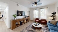 Located at 4201 William Fleming in Fort Worth, TX, this single-floor, 2-bedroom, 2-bathroom residence offers a thoughtfully designed layout with modern finishes throughout. Light wood-look flooring flows seamlessly across the living spaces, complemented by crisp white walls and ceiling fans in each room.

The open-concept living, dining, and kitchen area serves as the heart of the home. The living room features large windows that invite abundant natural light and offer outdoor views, while providing ample space for comfortable seating. The kitchen is outfitted with stainless steel appliances, dark granite countertops, a subway tile backsplash, and taupe cabinetry with black hardware — a clean, contemporary aesthetic paired with everyday functionality. A dedicated dining area sits adjacent to the kitchen.

The primary bedroom is a calm retreat with a ceiling fan, generous proportions, and access to a spacious walk-in closet with wrap-around wire shelving. The second bedroom also features a ceiling fan and a bright window. Both bathrooms are well-appointed, with one featuring a tub-shower combo with black fixtures and a single vanity.

A dedicated laundry room houses a full-size washer and dryer. Additional storage is provided through a pantry and closets. The hallway connects all areas efficiently, making the layout practical and easy to navigate.