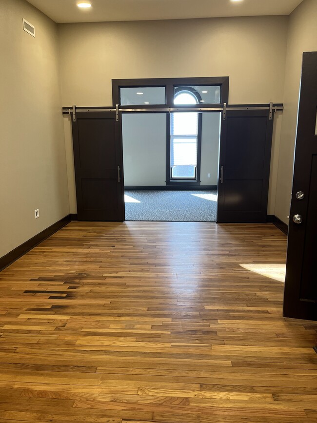 Bedroom Barn Doors + Transom Window - 200 E State St