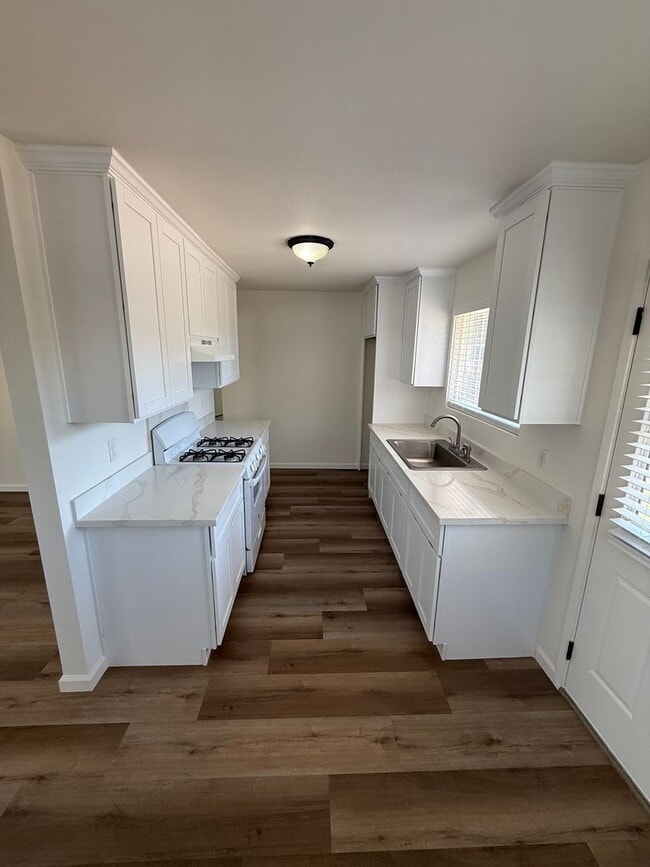 Building Photo - Updated Property with Large Front & Backyard