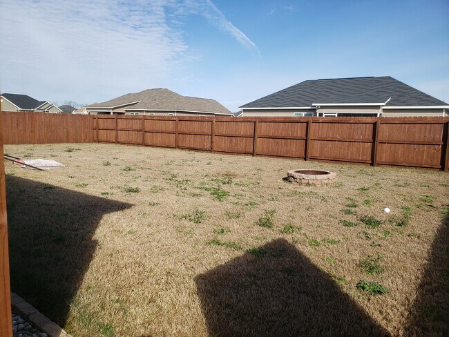 Fenced in backyard with firepit - 604 Tug Ct