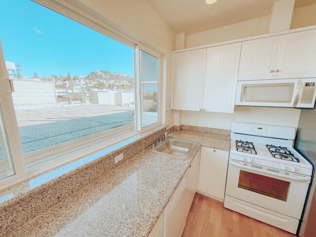 Kitchen with Dishwasher, Stainless Steel Fridge, Oven, and Microwave - 121 Carl St