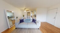 Located at 5800 Harper Dr NE in Albuquerque, New Mexico, this single-floor unit offers a well-organized and functional layout with a clean, modern aesthetic throughout. The open living area is bright and welcoming, featuring warm hardwood-style flooring, neutral white walls, and a ceiling fan with light fixture. A sliding glass door fills the space with natural light and provides access to an outdoor patio area, offering views of the surrounding neighborhood. The living room flows naturally into a compact dining area, making the shared space ideal for everyday living and entertaining.

The galley-style kitchen is efficiently designed with ample white shaker cabinetry, dark countertops, and black appliances including a refrigerator and range. The layout maximizes counter and storage space, providing a practical cooking environment.

The unit includes two bedrooms, each featuring hardwood-style flooring, neutral walls, and windows dressed with light-filtering curtains that allow natural light to brighten the rooms. The bedrooms offer a calm and restful atmosphere with generous wall space and closet storage.

The full bathroom is clean and straightforward, featuring a tub-shower combination, a toilet, and a vanity, all finished in crisp white tones with wood-look flooring. Throughout the unit, the consistent use of light tones and natural materials creates a cohesive and comfortable living environment.