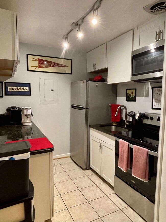 Kitchen with lots of storage, Whirlpool fridge and dual element electric ovenoven are 2 years old - 1413 T St NW