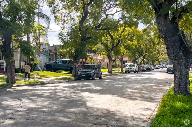 Serene neighborhood in South Gate has a tree on every lawn.