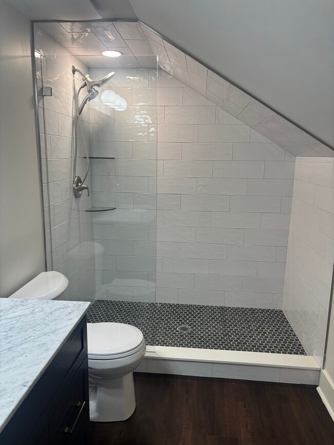 Walk-in shower with designer tile and custom door - 631 Woodland Ave SE