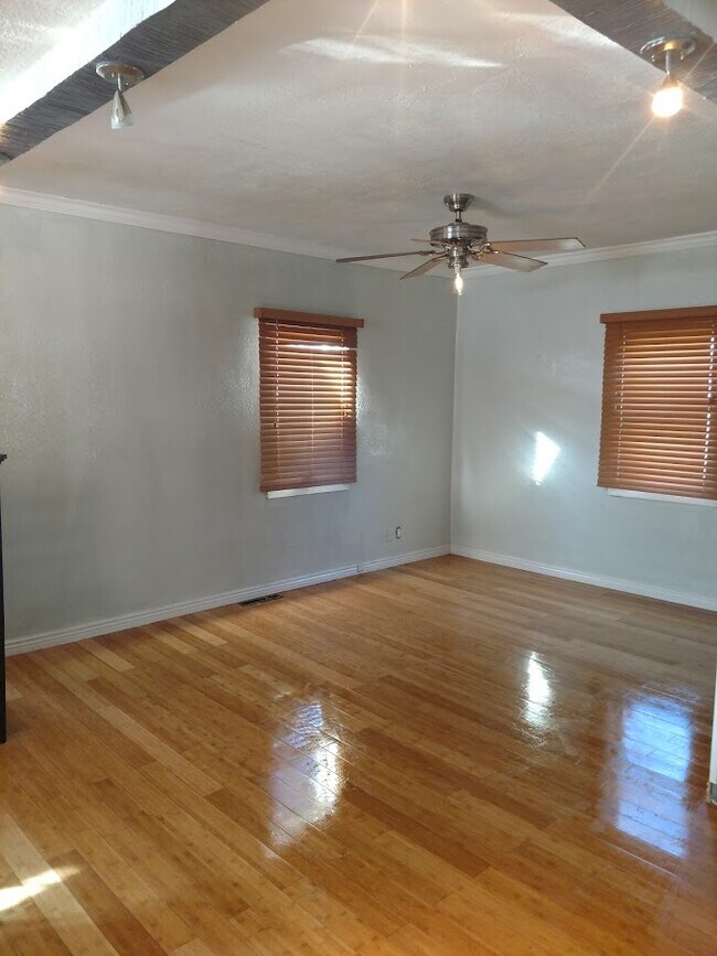 Dining Room -view from the kitchen (has white blinds now) - 1565 W B St