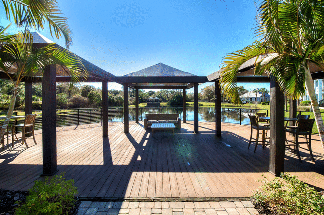 Audubon Village – Lakeside deck with gazebos and seating with a view of the lake. - Audubon Village