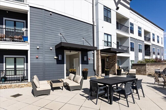 Building Photo - Bright 1BR Corner Condo in NoDa – Walk to Dining, Breweries & Light Rail