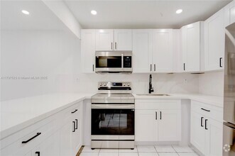 Building Photo - 6095 W 19th Ave