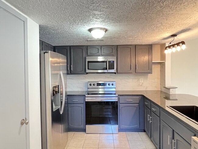 Kitchen- stainless steel appliances - 12214 Wild Pine Dr