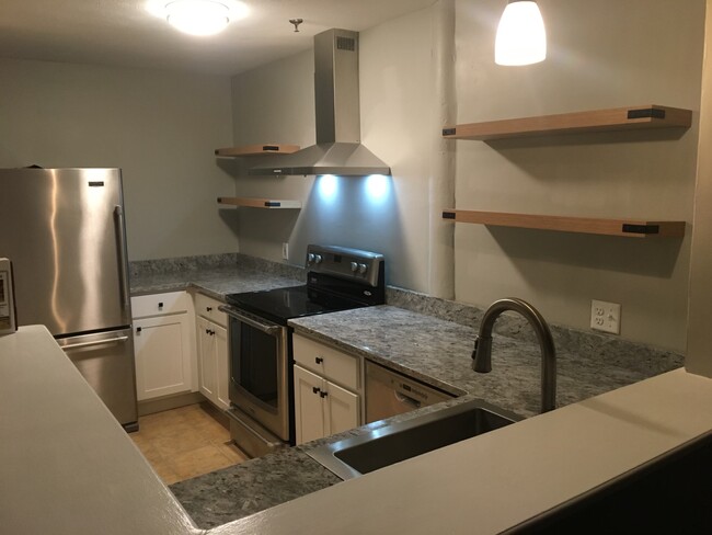 Kitchen has new cabinets and shelves - 110 Main St