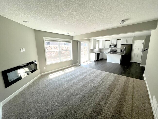 Open concept family room with fire place - 9662 Canter Ct