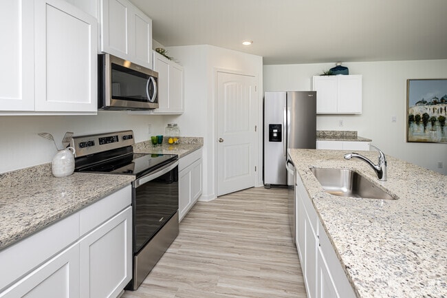 4BR, 2BA - 1,819SF - Kitchen - Villas at Oak Bend - Home Rentals