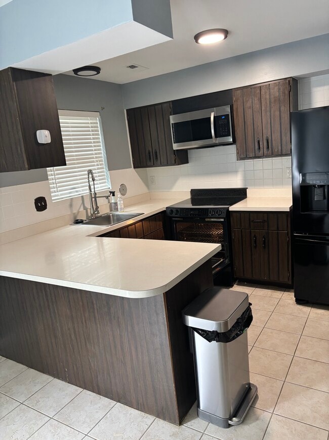 Spacious kitchen (cabinets/countertops being updated) - 825 Dumont Pl