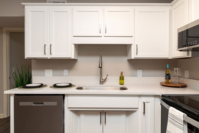 Kitchen with quartz counters, stainless appliances, and modern cabinetry - Vetra Providence