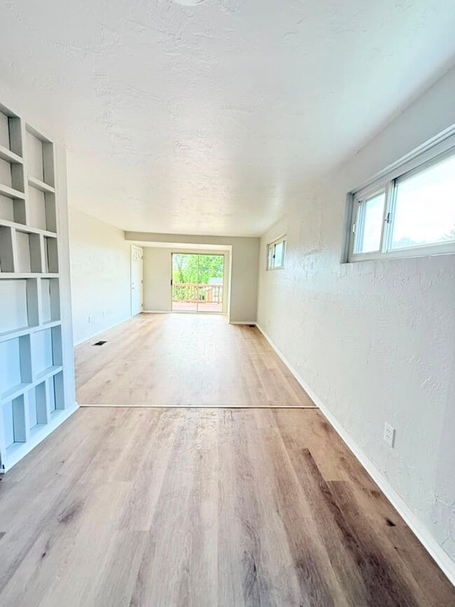 Photo - Newly remodeled 3-bedroom, 1.5-bath home featuring granite countertops, central A/C, and a partia...
