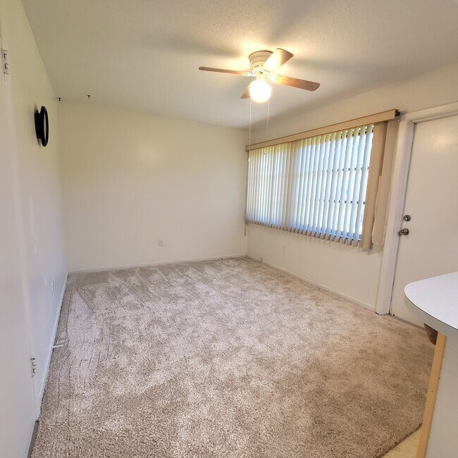 Bonus room next to kitchen with door to backyard - 6775 Armand Pl N