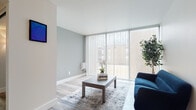 Located at 990 Morris Rd in Kent, Ohio, this single-floor residence offers a thoughtfully designed layout that balances comfort and functionality. The living area is a standout space, bathed in natural light streaming through floor-to-ceiling vertical blinds that span an entire wall, creating an airy, open ambiance. Light hardwood-style flooring and soft neutral wall tones lend the room a clean, modern aesthetic.

The kitchen is well-equipped and efficient, featuring rich dark-stained wood cabinetry, light granite-style countertops, and stainless steel appliances including an electric range, overhead microwave, and sink with ample cabinet storage. The light wood flooring ties seamlessly into the rest of the living space.

The bedroom offers generous storage through dual built-in closets, each equipped with shelving and hanging rods, and is finished with plush carpeting for added comfort. A separate room, also carpeted and featuring an exposed brick accent wall and a window with natural light, provides a quiet retreat well-suited for use as a home office or study.

Together, these spaces create a residence that is both practical and inviting, offering a comfortable living experience in the heart of Kent, Ohio.