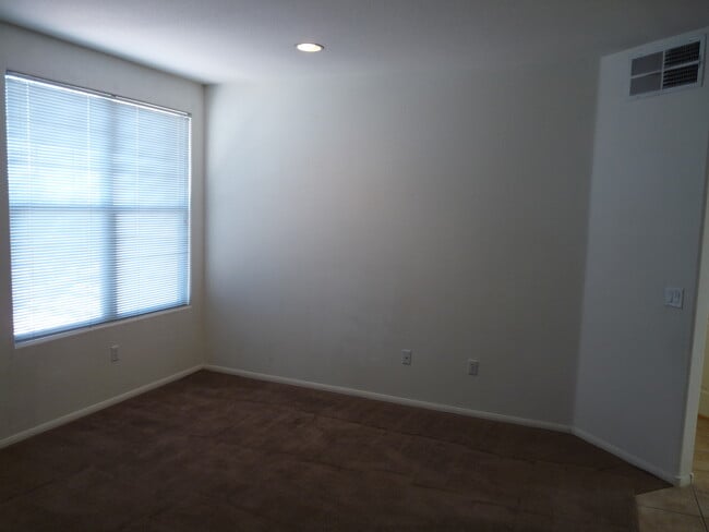 Building Photo - GATED 2 BEDROOM, 2 BATH CONDO IN JASMINE RANCH COMMUNITY