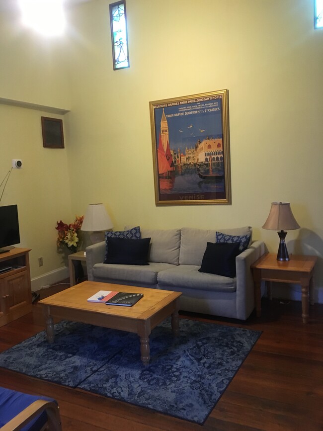 Living room, cathedral ceiling, gas fireplace. - 1007 E St SE