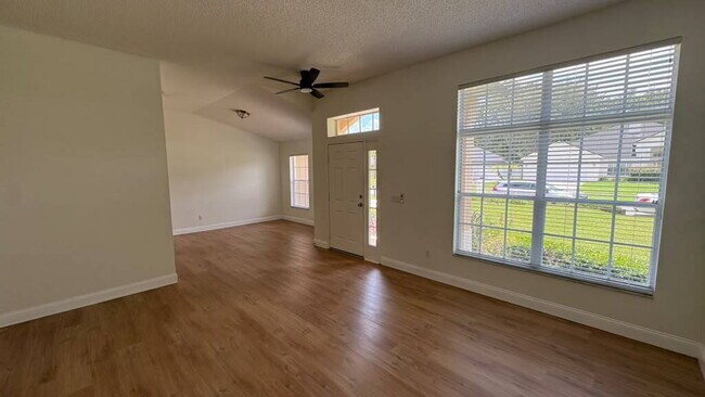 Building Photo - "Stunning 4-Bedroom Lake View Home in Oviedo – Spacious 2,132 Sq Ft Retreat!"