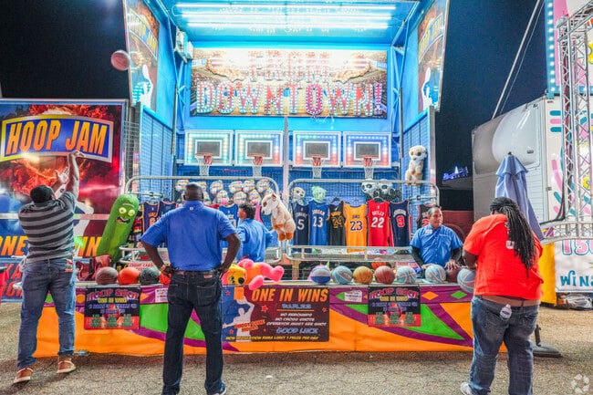 At the Mississippi State Fair in Jackson, players compete to win prizes in carnival games.