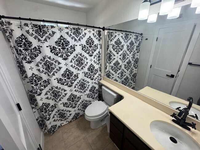 Building Photo - Furnished Bedroom rental with Bonus Kitchenette and office room