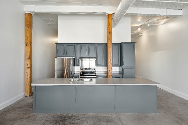 Kitchen w/ Bar Open to Living Room - RiverLofts @ 460 Tennessee