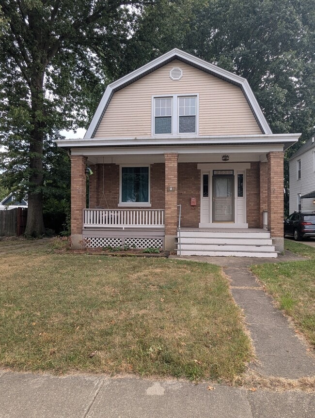 Front of house, driveway to the left with 2 car detached garage - 2539 Marsh Ave