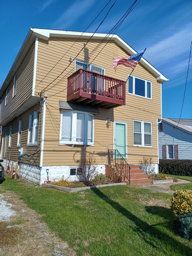 Front of house w/ bay window - 7310 Bay Front Rd