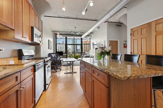 Kitchen is stocked with dishes, pots etc! - 221 E Cullerton St