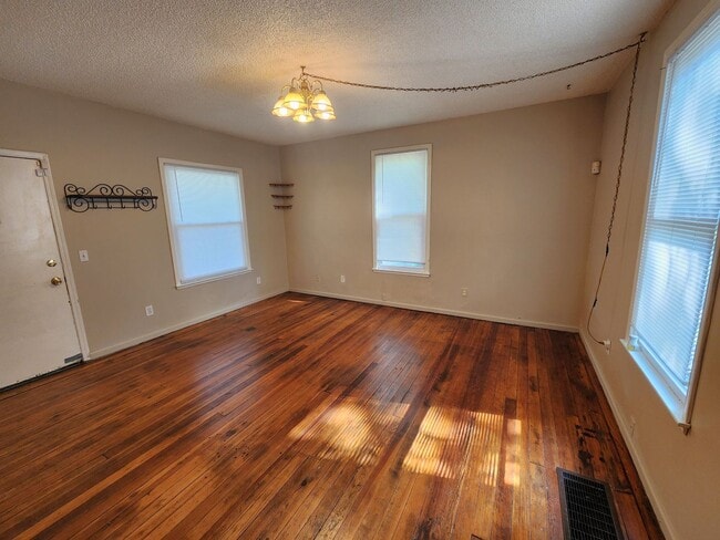 Building Photo - Nice home with oversized 2car gar with work bench and large shaded yard. Country-like setting