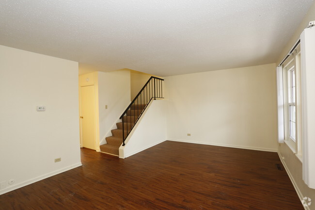 3BR, 1.5BA - Living Room - Squire Village Apartments