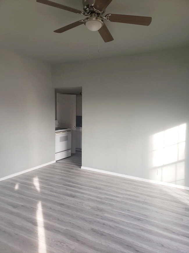 FRONT ROOM WITH KITCHEN ENTRY - 401 E Church St