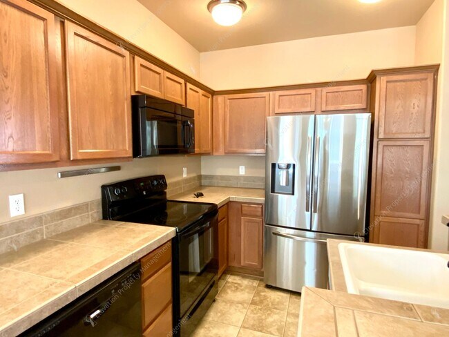 Building Photo - 3  BR home with new flooring in a great NE...