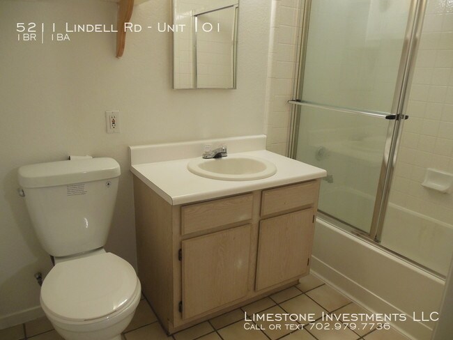 Building Photo - Single story unit with tile throughout.