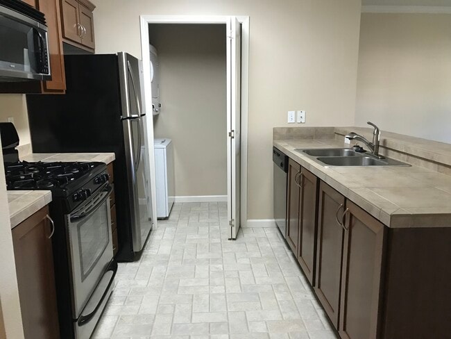 Kitchen and Pantry view from Foyer - 15054 NW Central Dr