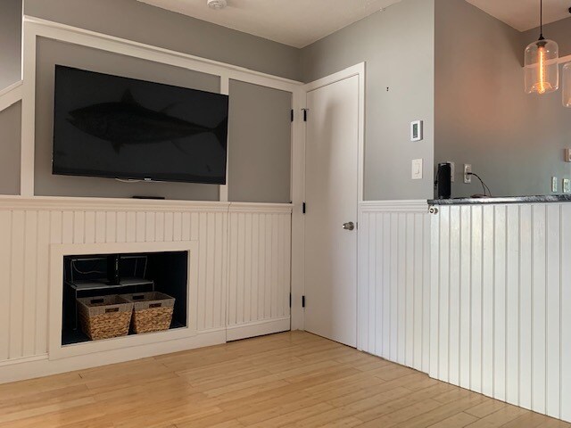 Wainscoting throughout first floor, wall-mounted TV on fully articulating arm. - 31 Betts Plz
