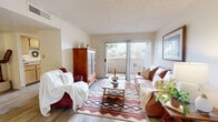 Located at 1920 W Valencia Rd in Tucson, AZ, this one-bedroom, one-bathroom unit offers a well-organized single-floor layout with a warm, Southwestern-inspired ambiance. Wood-look flooring runs throughout the space, complementing the light, neutral color palette on the walls and textured ceilings.

The living room serves as the heart of the unit, featuring a sliding glass door that opens to a private balcony, filling the space with natural light and outdoor views. Adjacent to the living area are two distinct dining spaces, providing flexible options for both casual and more formal dining. The dining area is accented by warm-toned walls and a ceiling-mounted light fixture.

The galley-style kitchen is efficiently designed with light wood cabinetry lining both sides, black appliances including a range and refrigerator, a double sink, and a window that brings in additional natural light.

The bedroom is a comfortable retreat with a window dressed in sheer curtains, a textured ceiling, and ample room for furnishings. A dedicated closet provides practical storage. The bathroom features a tiled shower-tub combination, wood-look flooring, and a clean, functional layout. Throughout the unit, the design reflects a cohesive and inviting Southwestern character.