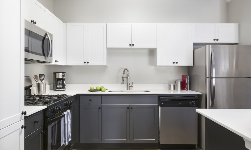 Sophisticated kitchen with two-toned cabinetry - Stone Gate