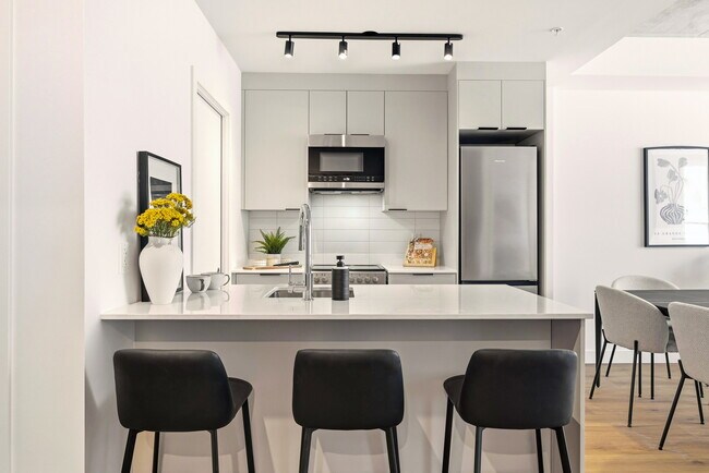 Photo du bâtiment - SUMA – condos locatifs