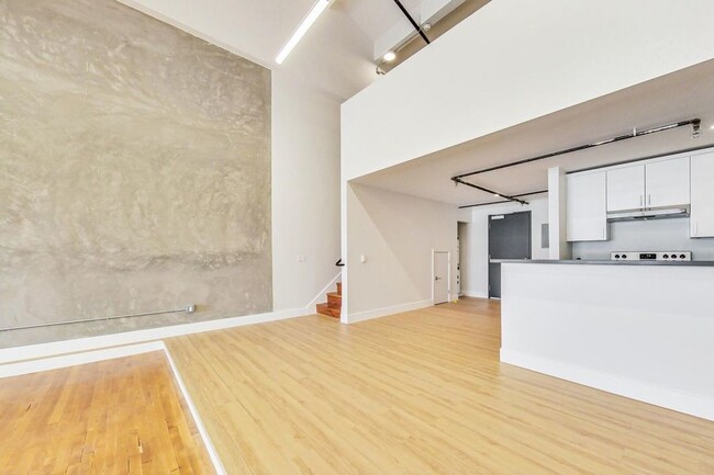 Building Photo - Beautiful loft with vaulted ceilings and l...