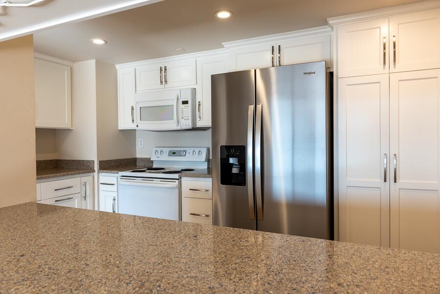 Kitchen with new refrigerator. Refrigerator has a triple-osmosis water filter - 500 N St