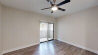 Located in Phoenix, AZ, this well-appointed one-bedroom, one-bathroom unit offers a thoughtfully designed layout that maximizes every square foot. The open-concept living and kitchen area serves as the heart of the home, where wood-style flooring flows seamlessly throughout. The kitchen stands out with crisp white shaker cabinetry, a classic subway tile backsplash, white quartz countertops, a breakfast bar peninsula, and a full suite of stainless steel appliances including a refrigerator, electric range, and built-in microwave. A skylight brightens the kitchen, adding a welcoming sense of openness.

The living area features a ceiling fan and a sliding glass door with vertical blinds that opens to a private outdoor patio, allowing natural light to fill the space. The bedroom is comfortably sized, appointed with its own ceiling fan, wood-style flooring, and a window with blinds that frames outdoor greenery. A dedicated closet provides ample storage. The bathroom includes a full tub-shower combination with chrome fixtures, complemented by neutral wall tones and wood-style flooring that tie the space together. Clean, light finishes and a neutral color palette throughout create a bright, move-in-ready environment.