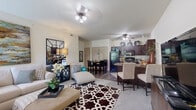 Located in Oklahoma City, OK, this 2-bedroom, 1-bathroom residence offers a thoughtfully designed single-floor layout that maximizes comfort and functionality. The open-concept living and dining area creates a seamless flow, with plush carpeting, ceiling fans, and natural light streaming through window treatments. The living room provides generous space for relaxing and entertaining, anchored by neutral tones and tasteful finishes.

The kitchen is a standout feature, showcasing rich dark wood cabinetry, granite-style countertops, a breakfast bar peninsula, and black appliances including a refrigerator, dishwasher, range, and microwave. Wood-look flooring grounds the kitchen and dining area, adding warmth and easy maintenance.

Both bedrooms are well-sized and carpeted, each with ceiling fans and windows that invite natural light. The primary bedroom offers a comfortable retreat with ample space for furnishings. The shared full bathroom features a tub-shower combination with sliding glass doors and dark wood cabinetry for storage.

Throughout the residence, a consistent neutral color palette with warm accents creates an inviting and cohesive ambiance, making this Oklahoma City home a well-rounded and livable space.