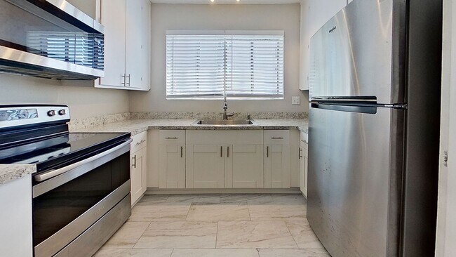 Foto del edificio - Riverfront Living! First Floor Unit w/ Private Patio, Stunning Views & Upgraded Kitchen