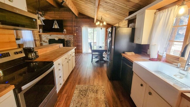 Building Photo - Move-In Ready 2-Bedroom Log Home with Wrap-Around Deck and Enclosed Yard