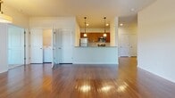 Located at 5611 First Ave E in Bradenton, Florida, this single-story residence offers a well-designed, open-concept floor plan that maximizes both space and functionality. Rich hardwood flooring flows throughout the main living areas, complemented by recessed lighting and ceiling fans that enhance the bright, airy atmosphere.

The kitchen is a standout feature, equipped with warm-toned wood cabinetry, granite countertops, and a full suite of stainless steel appliances including a refrigerator, range, microwave, and dishwasher. Pendant lighting above the breakfast bar adds a polished touch, while the open layout allows for seamless interaction between the kitchen and living area. A dedicated laundry area is conveniently accessible nearby.

The bedrooms are carpeted for comfort and receive generous natural light through large windows with horizontal blinds, offering pleasant outdoor views. Each bathroom is finished with tile flooring, a granite-topped vanity with warm wood cabinetry, and a tub-shower combination. One bathroom provides direct access to a walk-in closet, adding practical storage.

The living area is spacious and open, featuring a ceiling fan and multiple windows that invite natural light throughout the day. Overall, this residence delivers a clean, functional, and comfortable living environment in a convenient Bradenton location.