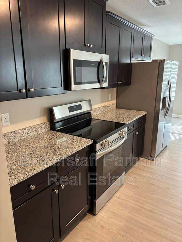 Building Photo - 6439 Sandy Bottom Dr